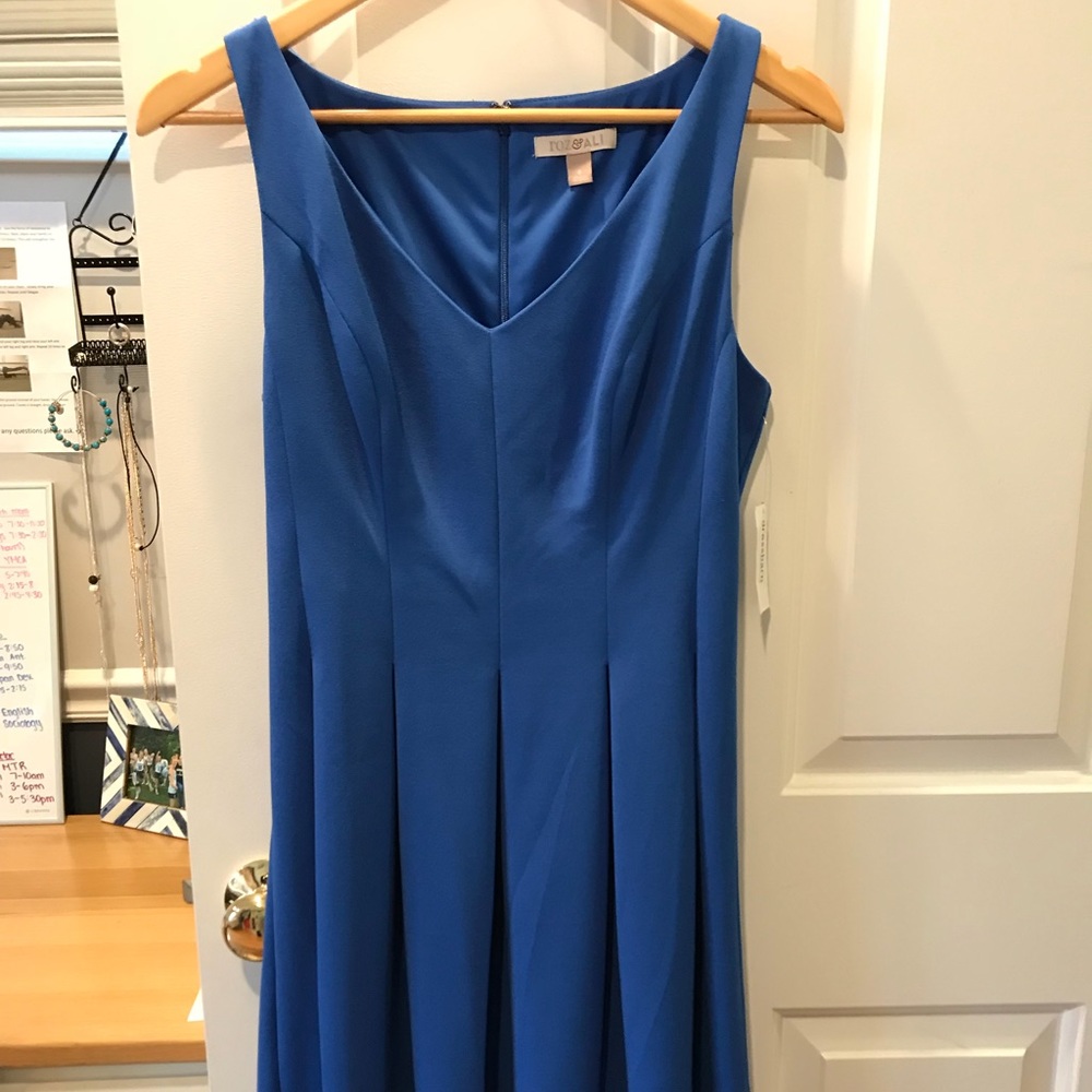 Blue knee length dress, tags still on
